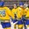 BUFFALO, NEW YORK - DECEMBER 26: Sweden's Fabian Zetterlund #28, Jacob Moverare #27, Linus Lindstrom #16 and Filip Gustavsson #30 celebrate a victory against Belarus during the preliminary round of the 2018 IIHF World Junior Championship. (Photo by Andrea Cardin/HHOF-IIHF Images)


